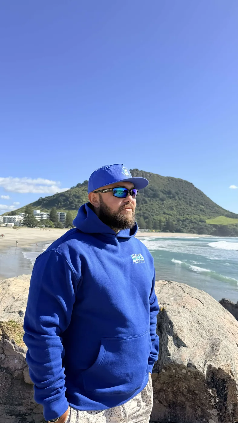 Waitā Poraka hoodie in kikorangi, front view
