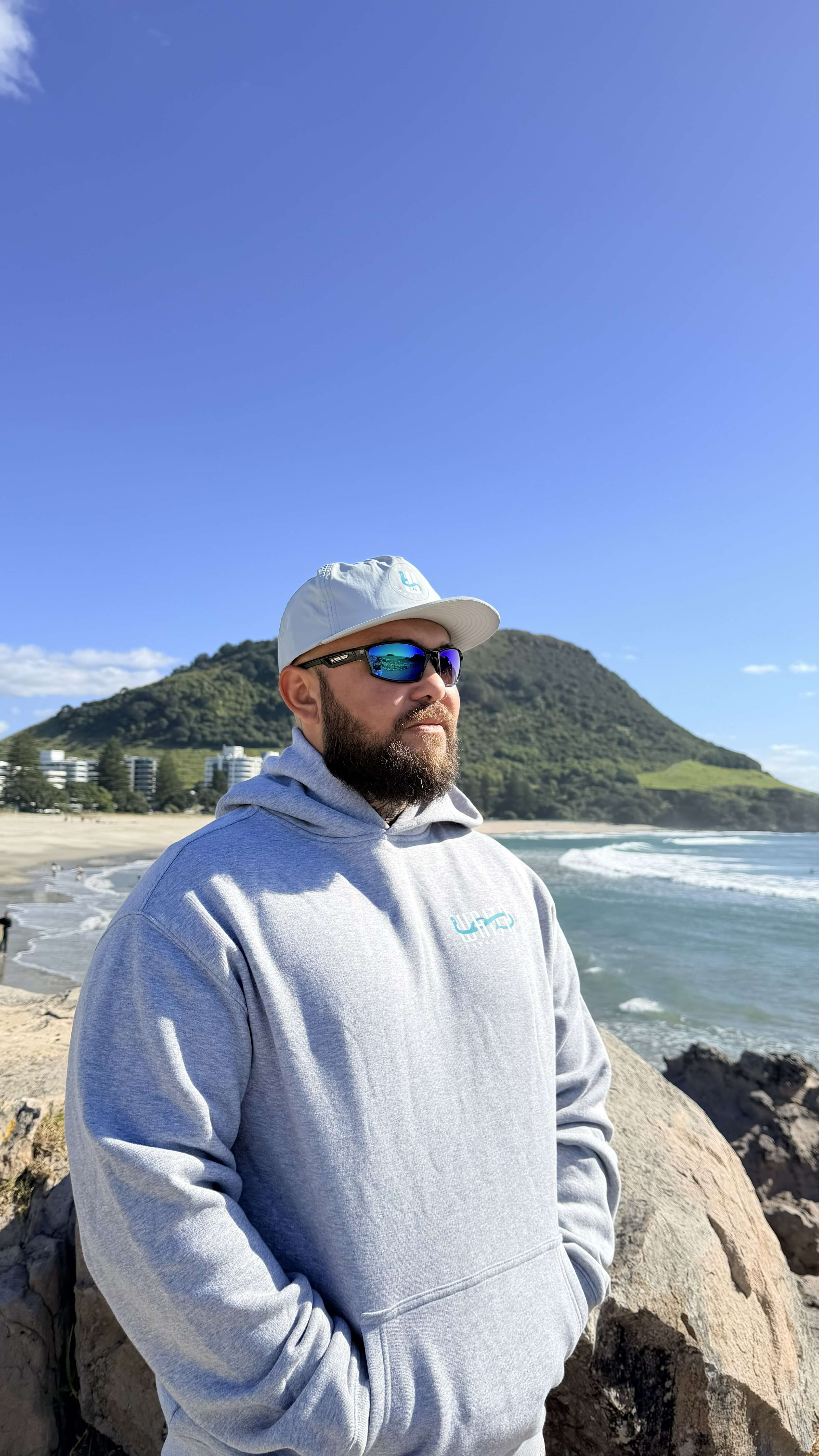 Waitā Poraka hoodie in kiwikiwi, front view